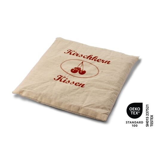 Wohlfühlen und entspannen bei einer Tasse Kirschtee und einem warmen Kirschkernkissen. Tee und Kissen kommen in einer roten Geschenkbox.