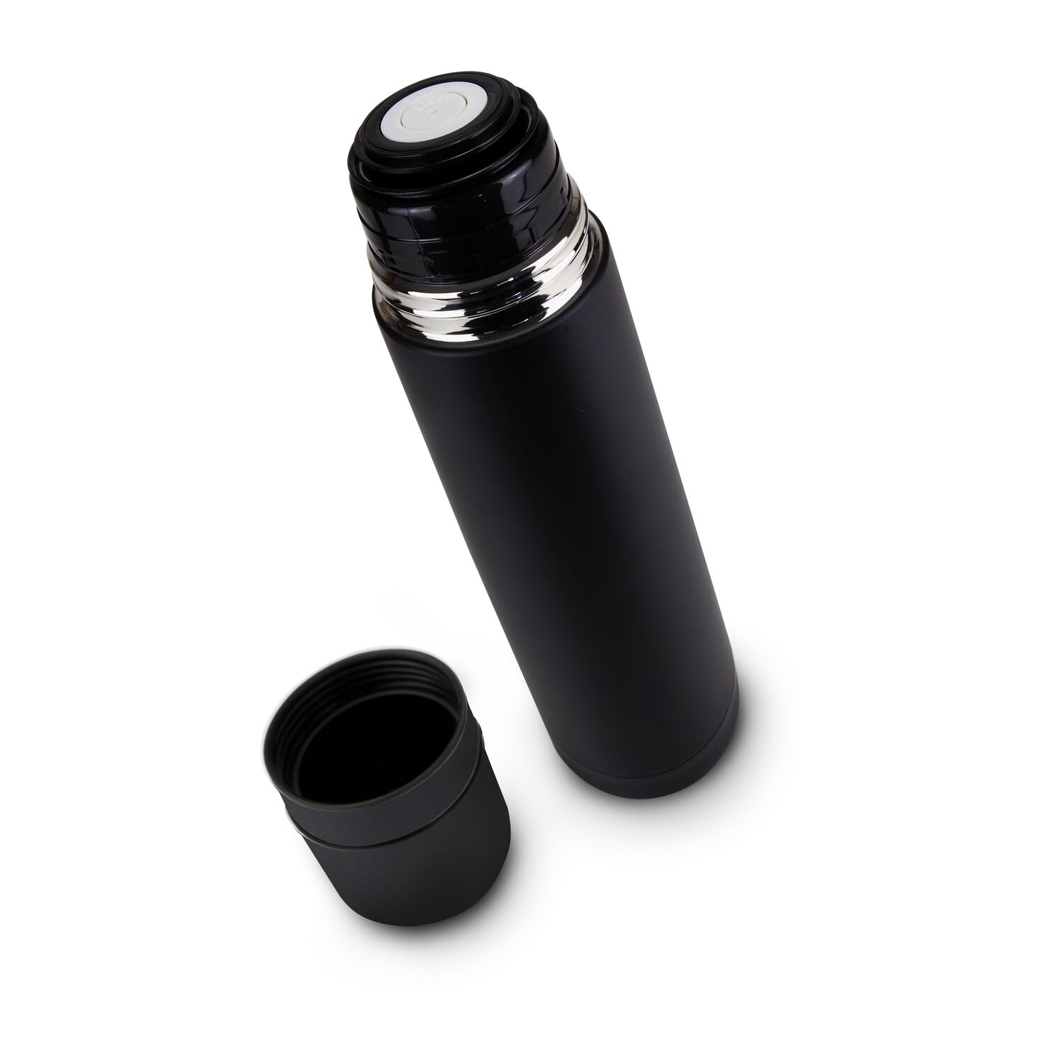 Eine ROMINOX® Isolierkanne Cup in Cup in Schwarz und eine Flasche Glühwein - verpackt in einem schwarzen Geschenkkarton.