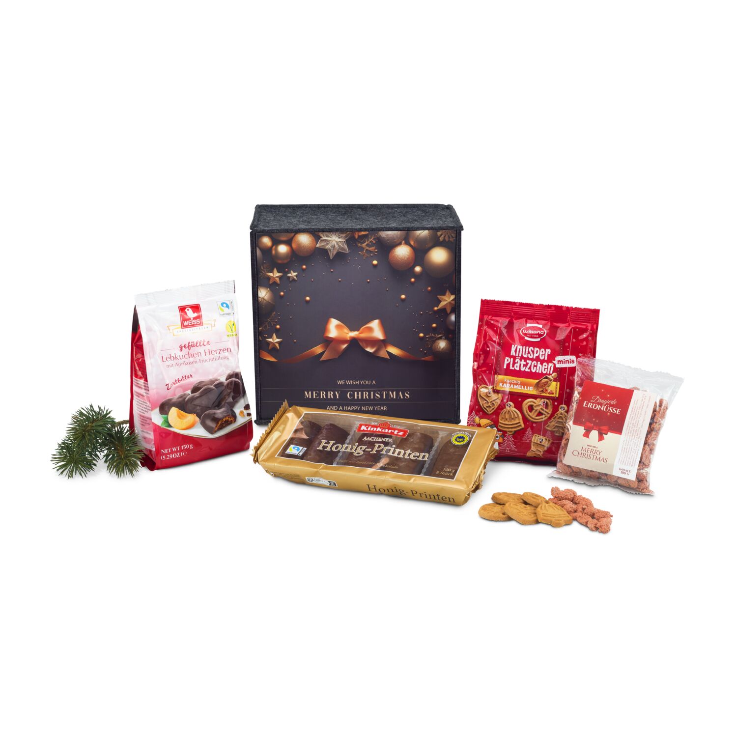 In diesem ROMINOX® Filzkorb befinden sich Honig-Saftprinten, Mini Plätzchen, Lebkuchen Herzen und dragierte Erdnüsse.