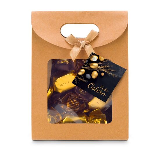 Je 4 Lindt-Nuxor-Pralinen (Feinherbe & Vollmilch Schokolade) verpackt in einer naturfarbenen Verpackung mit Schleife und Oser-Anhänger.