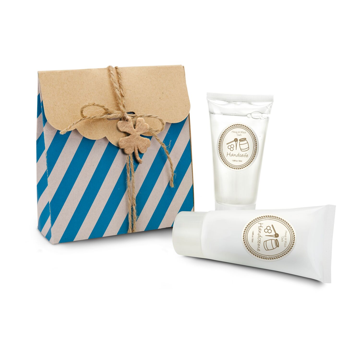 Papiertüte gefüllt mit je 50ml Handseife und Handcreme in der Tube, mit Glücksklee-Anhänger